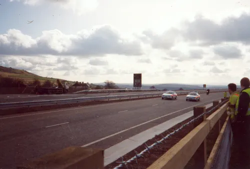 Police lead the first cars on the newly-opened A30 at Sourton Cross