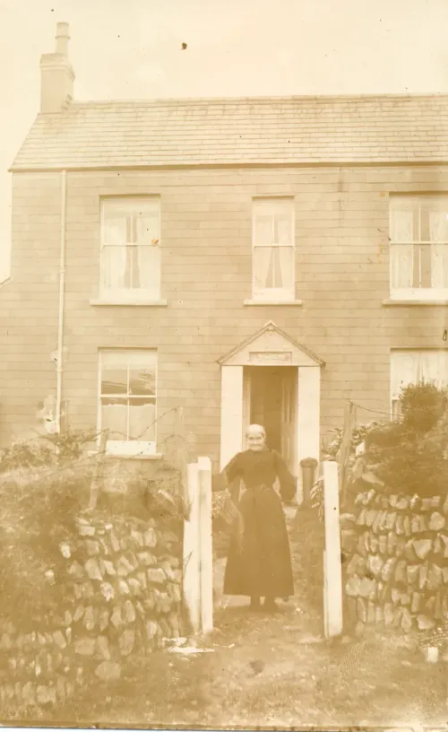 Unknown lady outside Church Cottage, Lydford