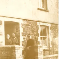 Ladies outside a cottage at Shellaford