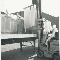 Loading product onto back of flatbed lorry using a forklift