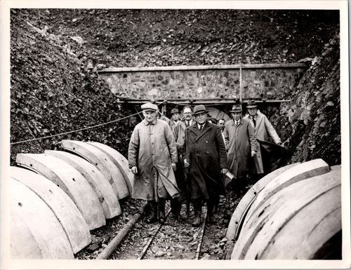 The Chairman and Vice Chairman of the North Devon Water Board emerge from the Prewley tunnel. Note the concrete panels used to construct the tunnel.