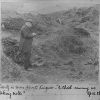 Robert Burnard standing in a ruin near Kingsett farm