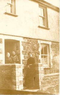 Ladies outside a cottage at Shellaford